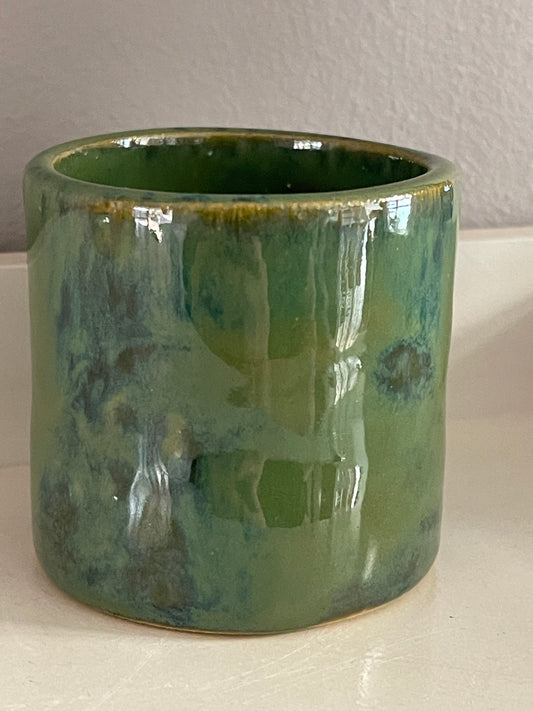 Small green hand built vase